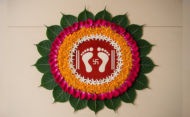 Goddess Lakshmi Footprint Rangoli with Peepal Leaves Goddess Lakshmi Footprint Rangoli with Peepal Leaves